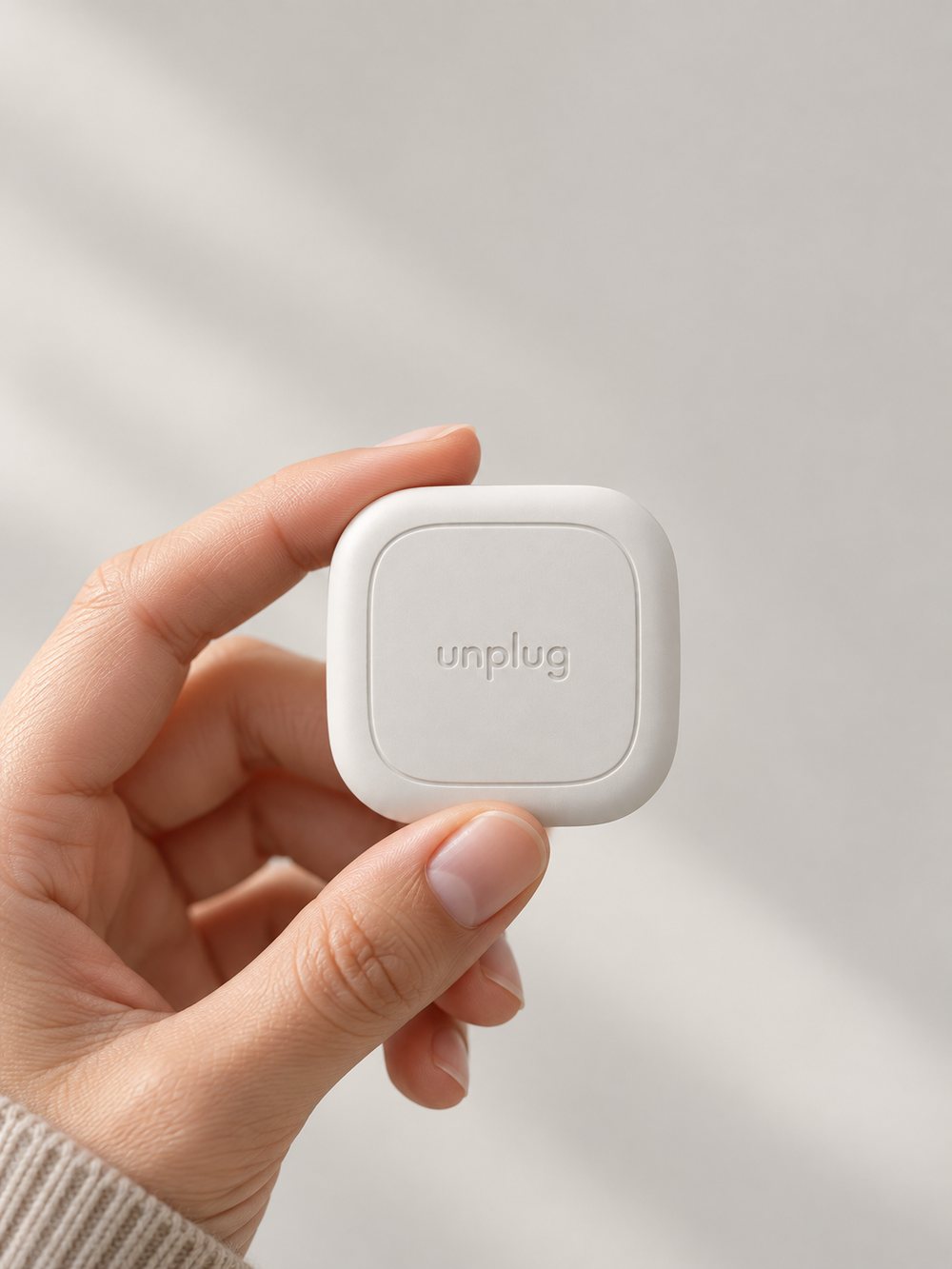 Hand holding the Unplug tag